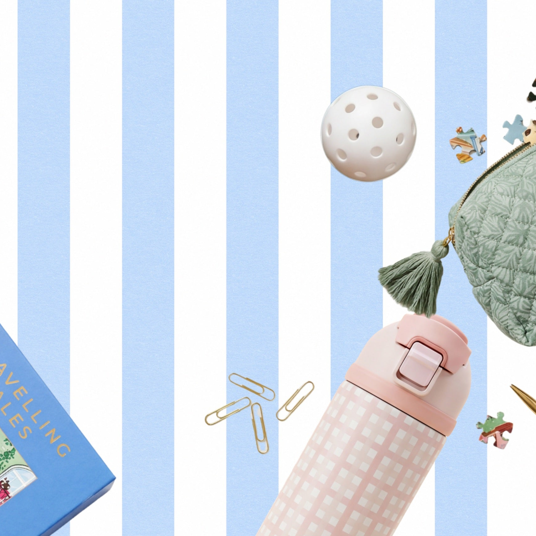 A styled flat-lay featuring a pink and white checkered insulated water bottle, surrounded by stationery props including paper clips, a quilted coin purse, a white perforated ball, and a blue book on a light blue and white striped background.
