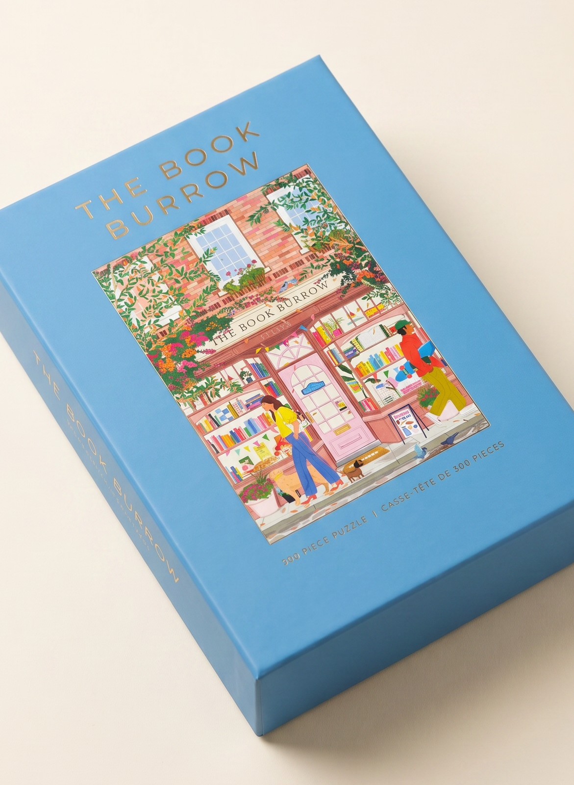 Blue puzzle box with 'The Book Burrow' illustration on a beige background