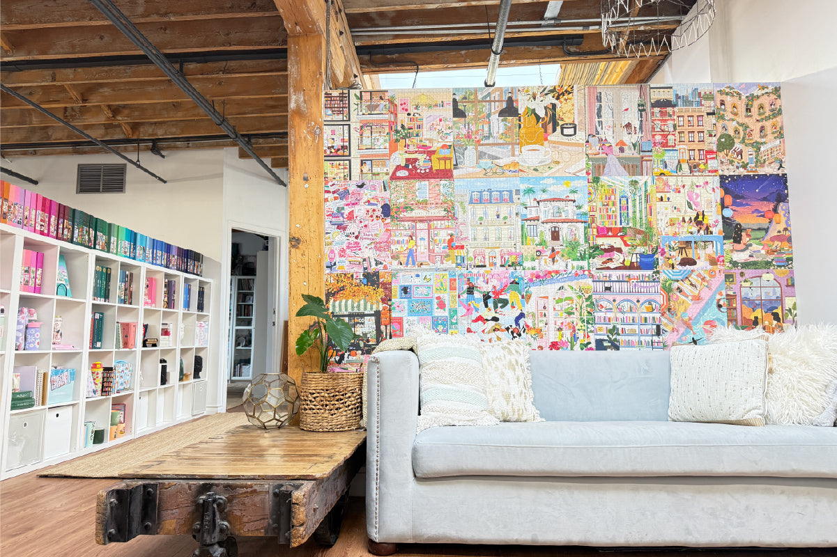 The Hobbry Studio with a colorful wall mural, white sofa, and bookshelf.
